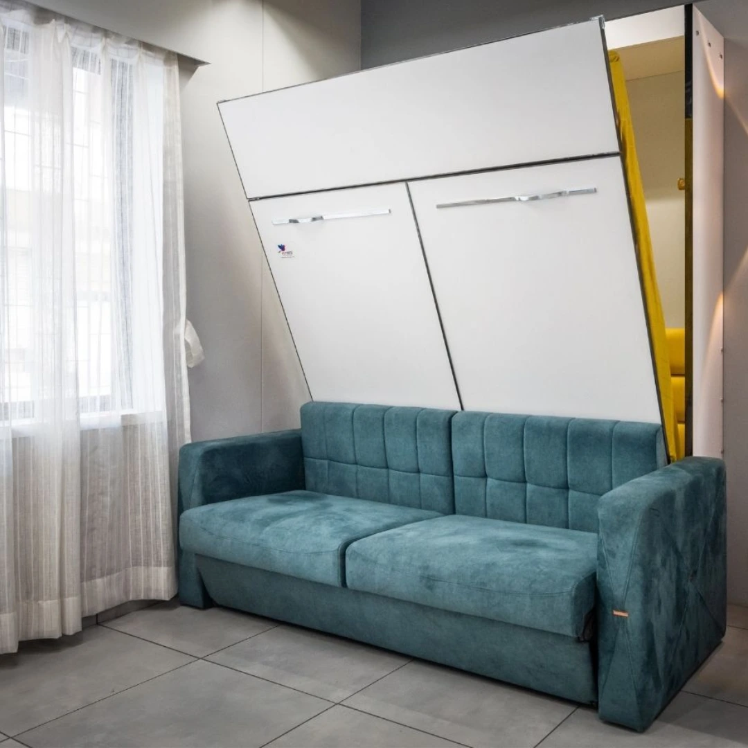 a teal colored murphy sofa with convertible back