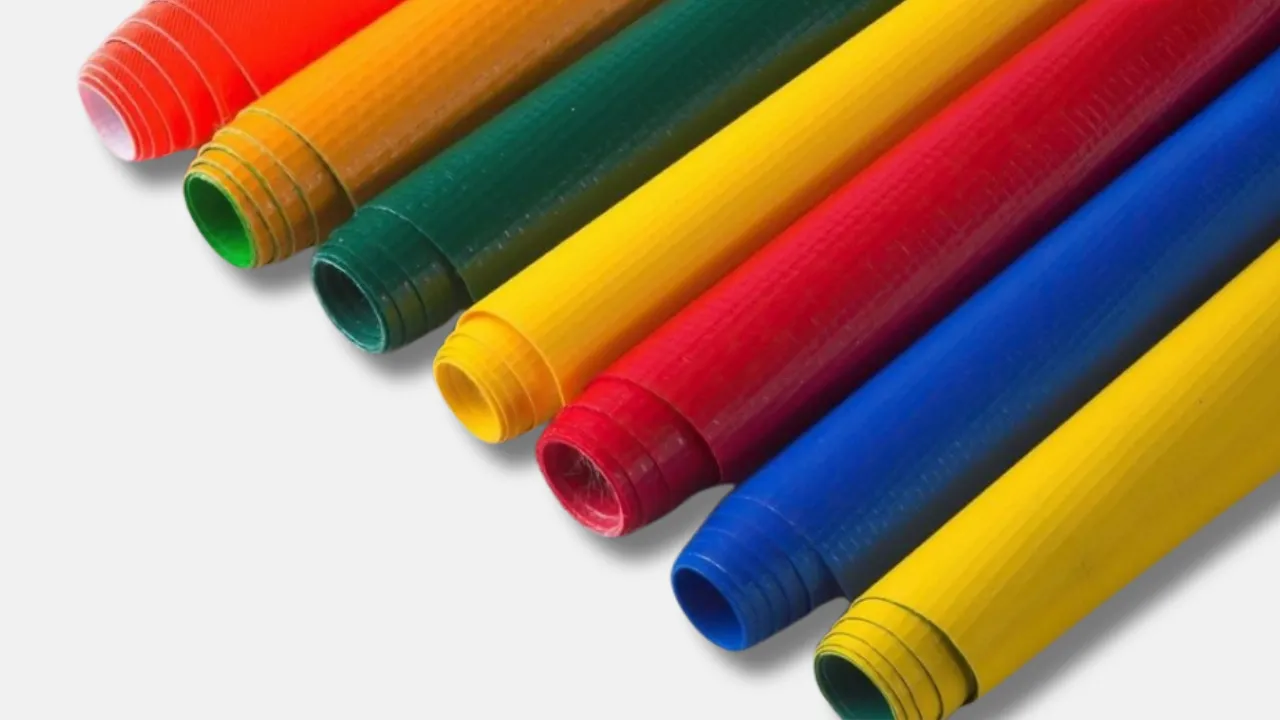 Close-up of colorful PVC tarpaulin rolls manufactured by leading tarpaulin supplier in India, offering strong, flexible, and weather-resistant tarps for industrial and commercial use