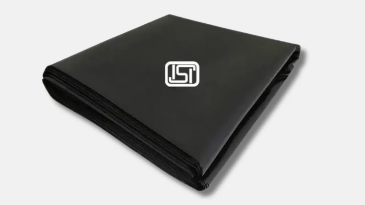 Folded black ISI-certified tarpaulin sheet manufactured by leading tarpaulin supplier in India, designed for high-strength applications in agriculture, industrial, and government sectors