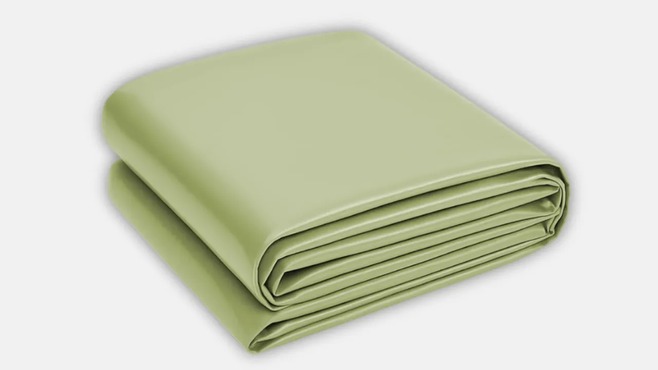 Folded light green waterproof HDPE sheet ideal for protecting goods from moisture during transport, storage, and industrial applications by trusted HDPE sheets manufacturer in India
