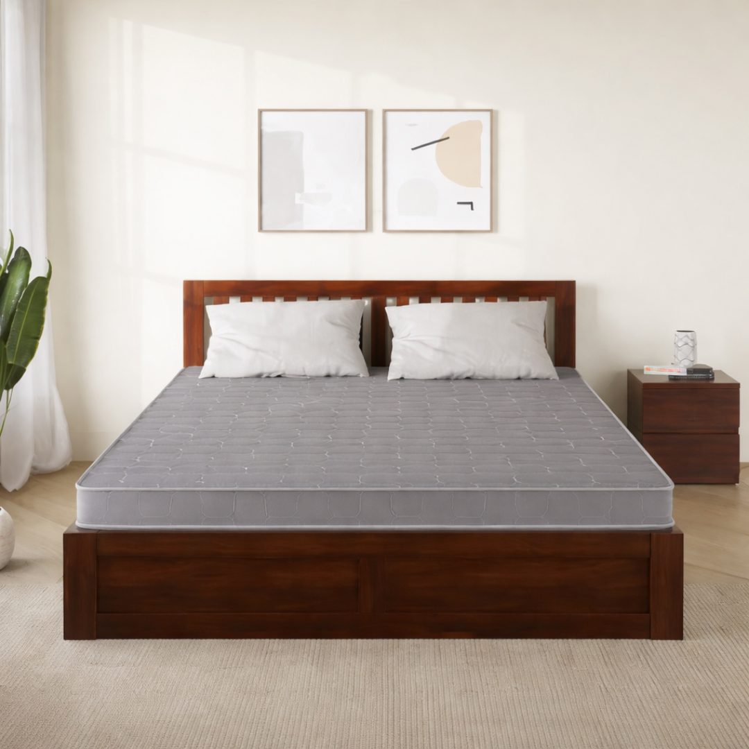 Comfortable double bed mattress in a modern bedroom, designed for daily household use, manufactured by mattress manufacturers in India for bulk and wholesale buyers.