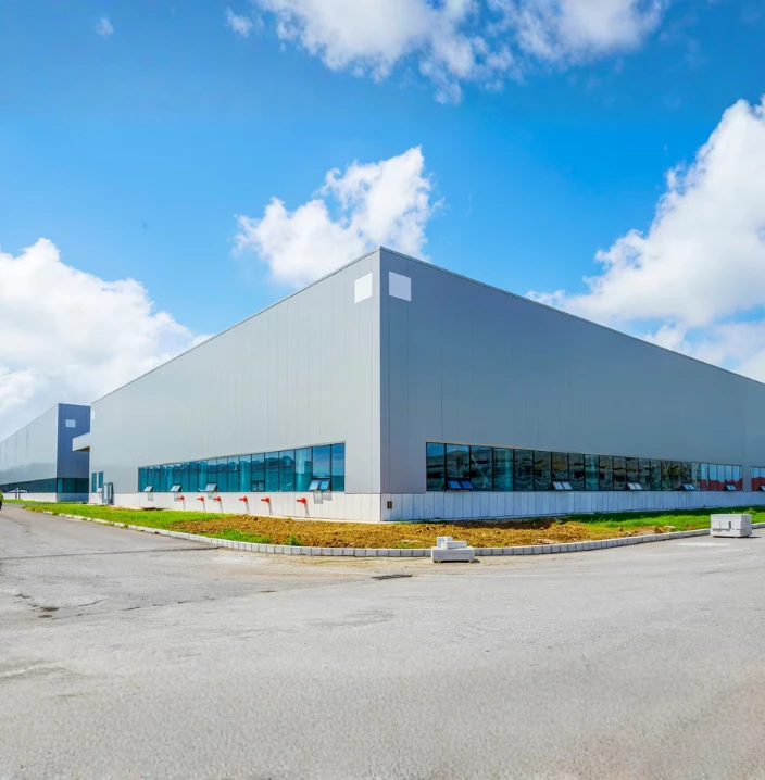 Modern industrial warehouse and commercial infrastructure developed by a leading construction company in Ahmedabad with contemporary architectural design.